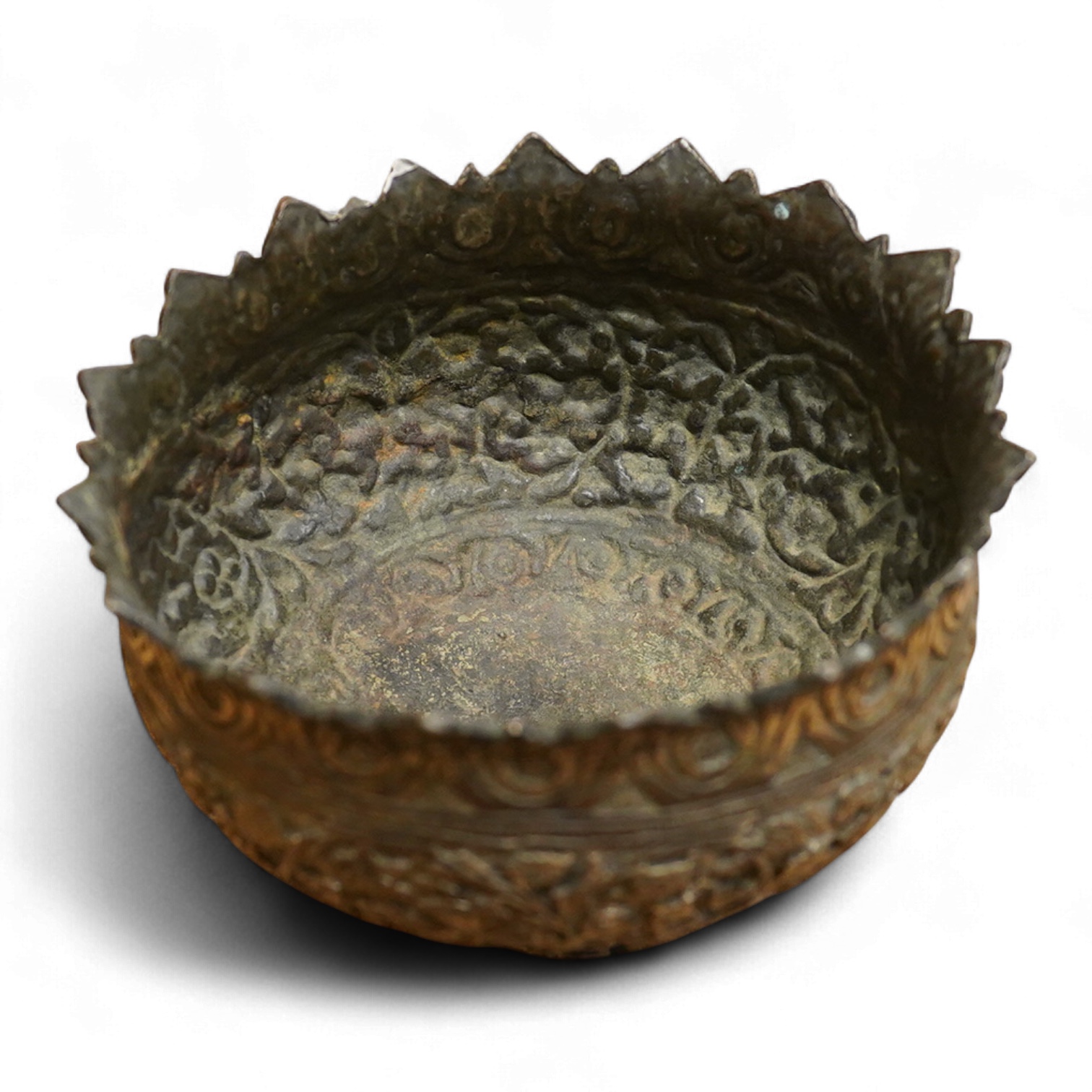 A 19th century Kashmiri base metal repousse bowl , with foliate border, diameter 10.8cm.